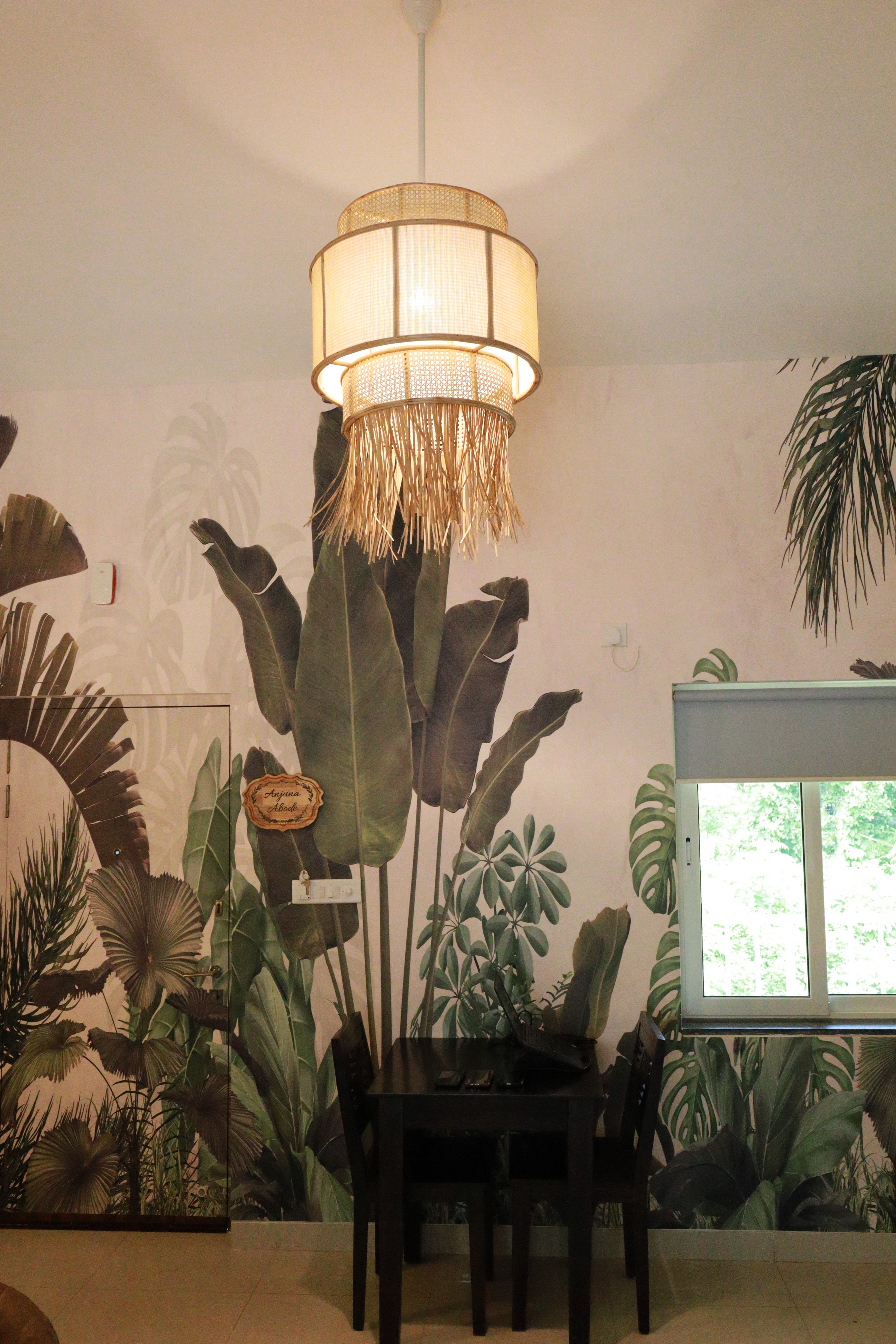 Anjuna Abode 1 — botanical mural with fringe pendant lamp