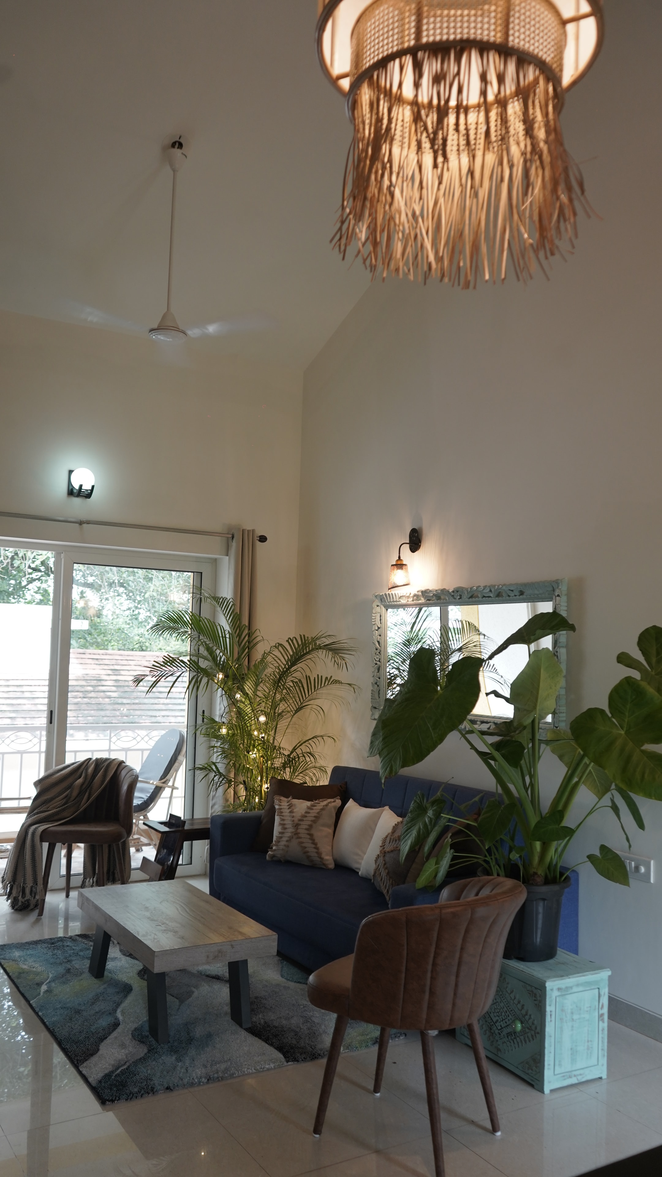 Anjuna Abode 1 — living room overhead view with sofa and pendant lamp