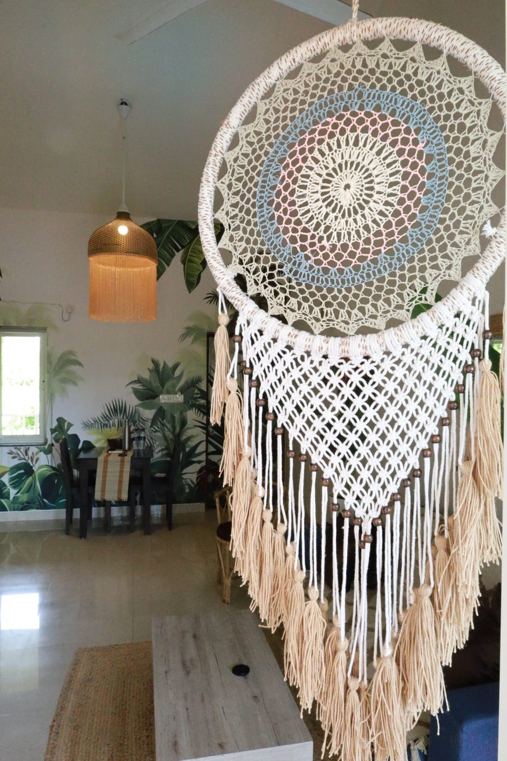 Anjuna Abode 2 — giant dreamcatcher with dining area behind